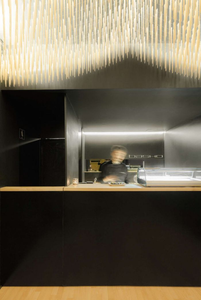 basho-sushi-bar-in-portugal-features-flying-chopsticks-on-ceiling-3-800x1192