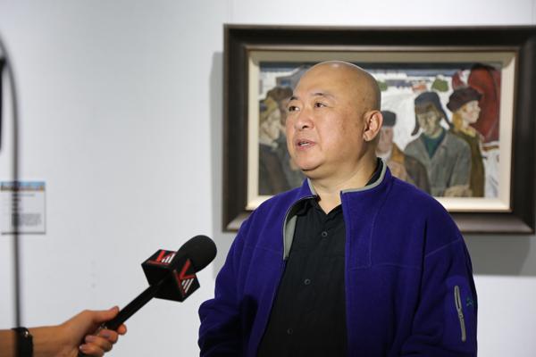 民革省委副主委、省美术家协会副主席匡伟光在接受采访.JPG