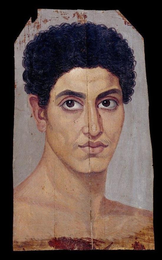 Limewood panel bearing portrait in encaustic and tempera of naked young man with curly hair， 80-120。 Courtesy of the British Museum。